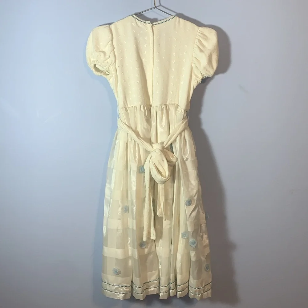 Vintage handmade girls puff sleeve white Cream Dress with Blue Floral rosette’s